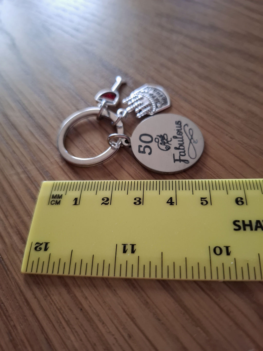 50 and Fabulous Keyring With a Wine Glass and Birthday Cake Charm